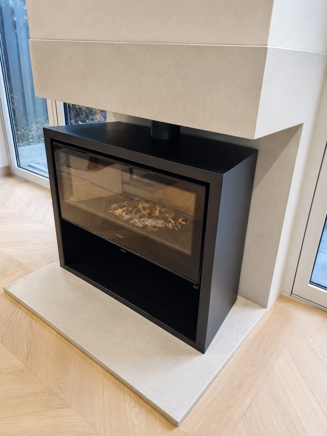 Bespoke media wall with fireplace surround in St Ives Cambridgeshire by Cromwell Interiors