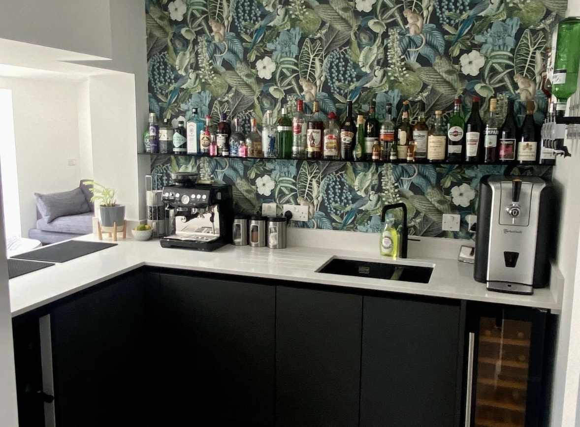 Bespoke home bar with feature wallpaper in Huntingdon Cambridgeshire by Cromwell Interiors